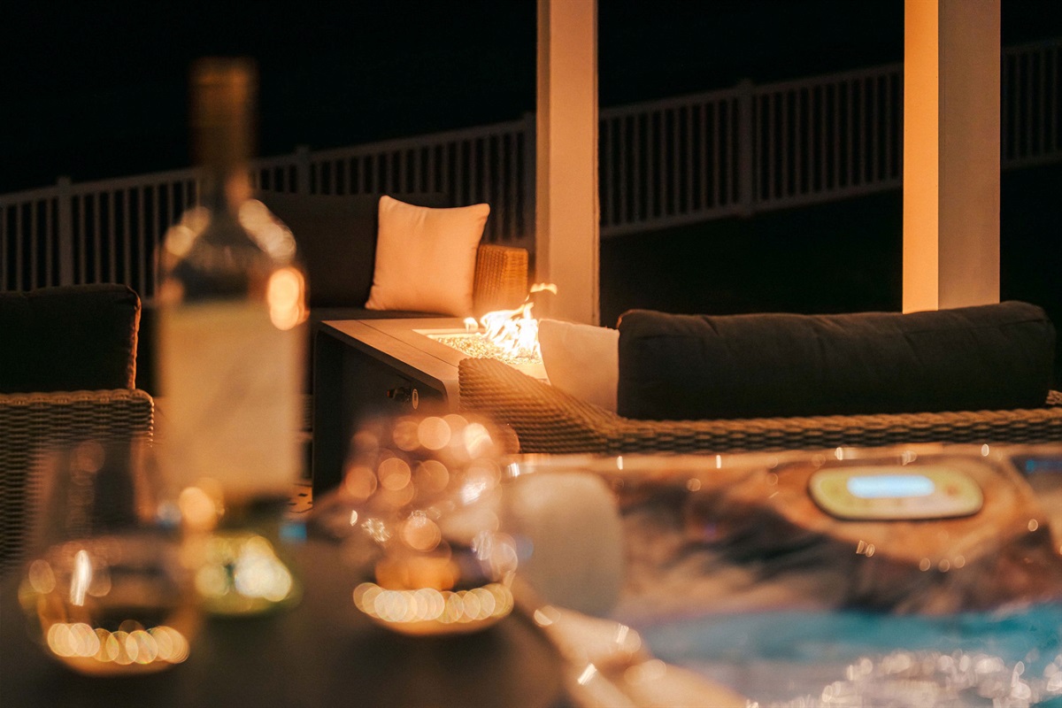 Evenings made better with the hot tub and nearby fire feature for warmth and ambiance