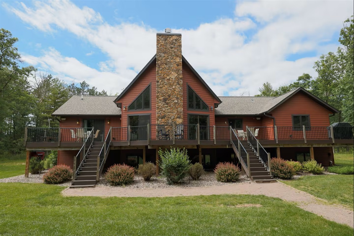 Expansive 70-foot deck with outdoor dining and grill - ideal for family meals and summer evenings.