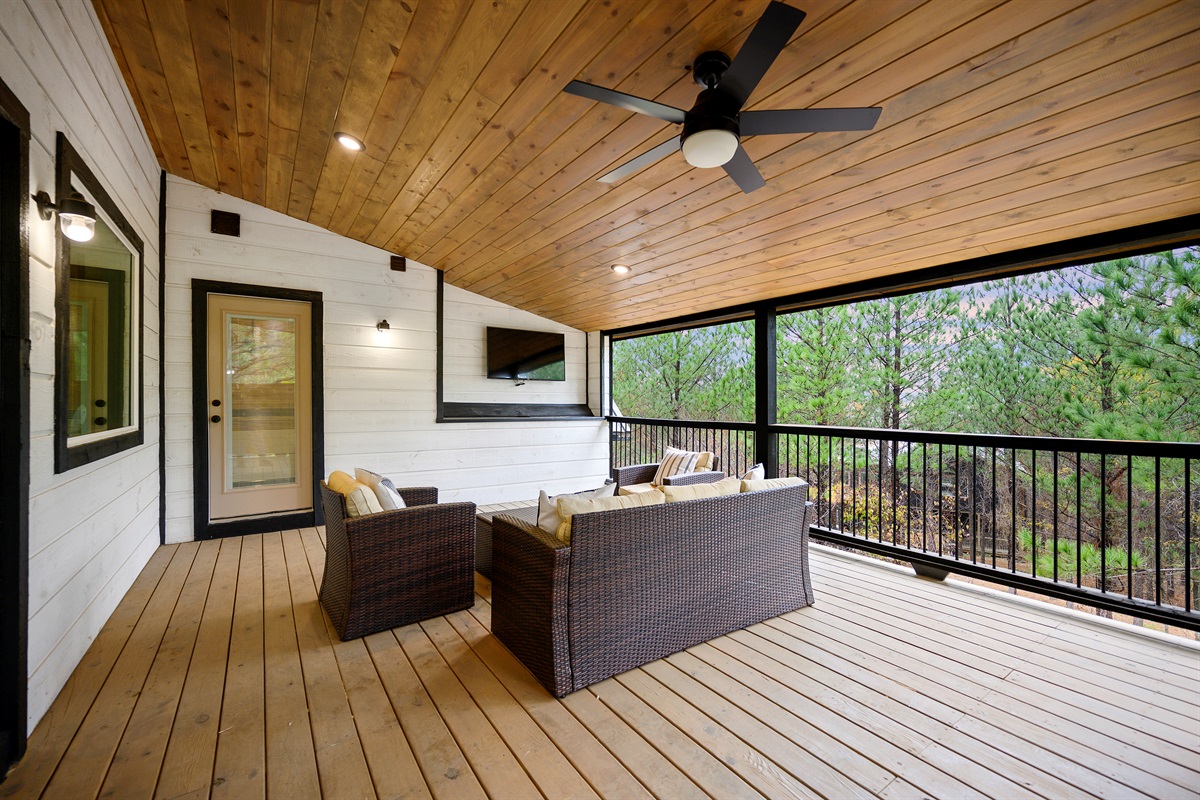 Upstairs covered deck access straight from the game room.
Morning coffee, late night laughs, and fresh air drifting through the trees. This is the kind of hangout spot that quietly becomes everyone’s favorite.