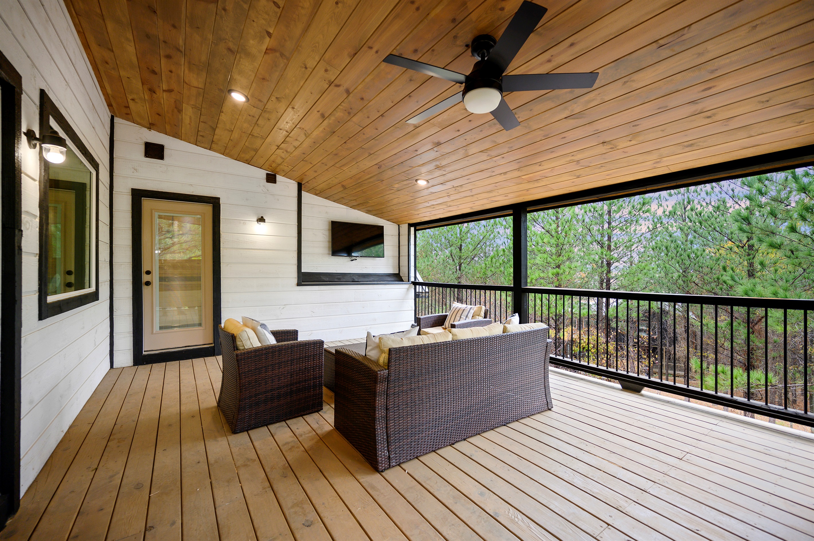 Upstairs covered deck access straight from the game room.
Morning coffee, late night laughs, and fresh air drifting through the trees. This is the kind of hangout spot that quietly becomes everyone’s favorite.
