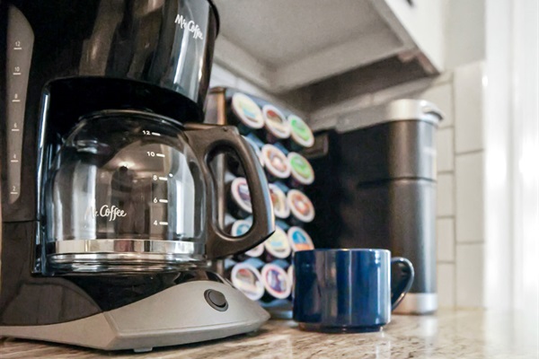 Coffee pot with ground coffee as well as a Keurig with limited K-cups provided