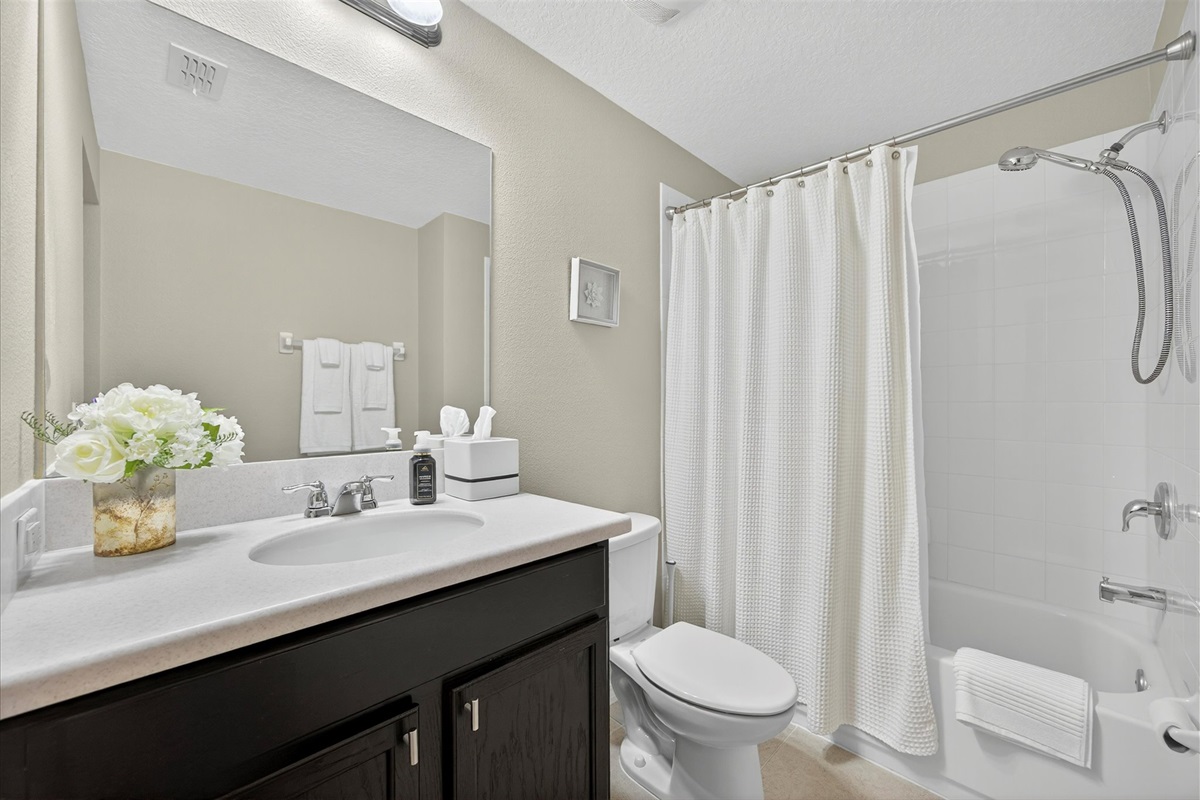 Modern bathroom with double vanity and designer touches.
