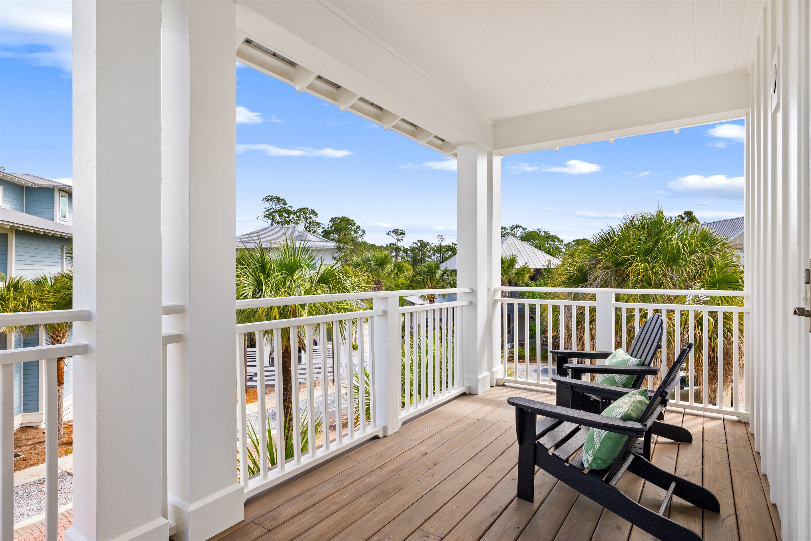 Enjoy the coastal breeze from this spacious upstairs balcony, a perfect spot for morning coffee, afternoon relaxation, or gathering with family and friends.