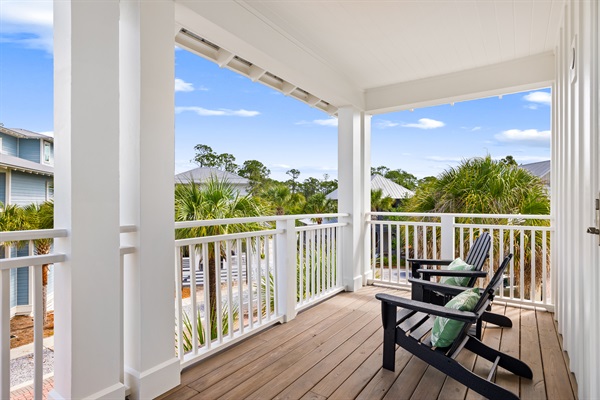 Enjoy the coastal breeze from this spacious upstairs balcony, a perfect spot for morning coffee, afternoon relaxation, or gathering with family and friends.