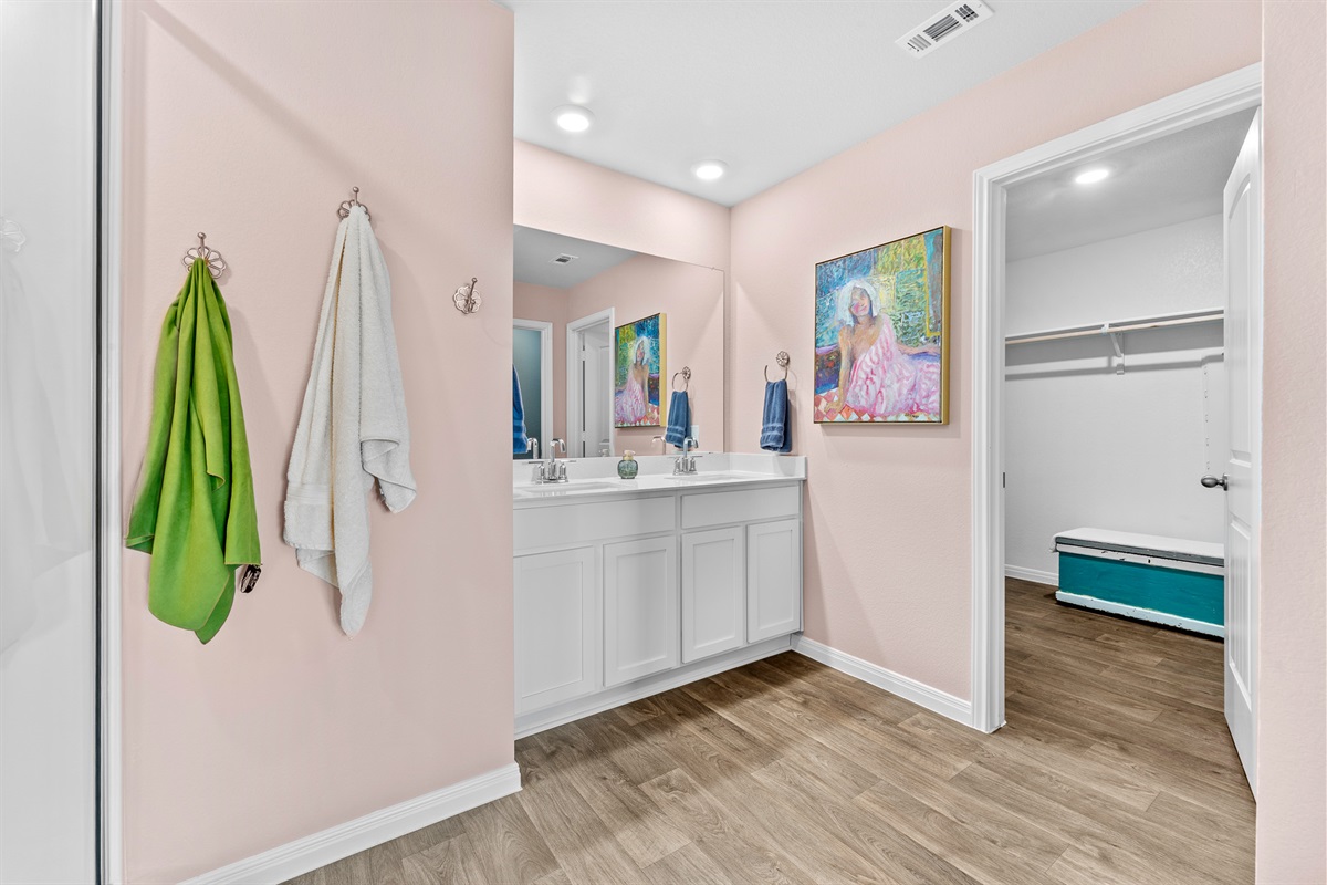 The master bath leads to a huge walk in closet and dressing room