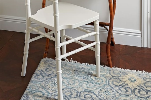 A vintage rattan writing desk, ideal for a private Zoom call or for catching up on emails in comfort and style.