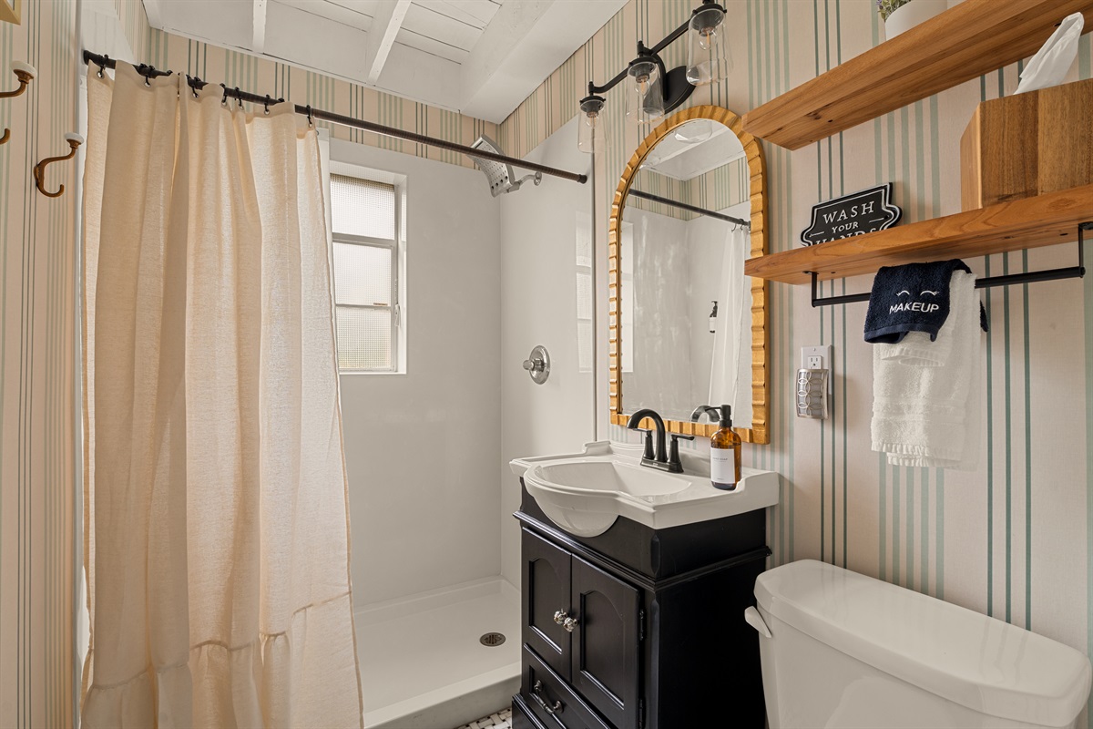 Full bathroom with walk-in shower.