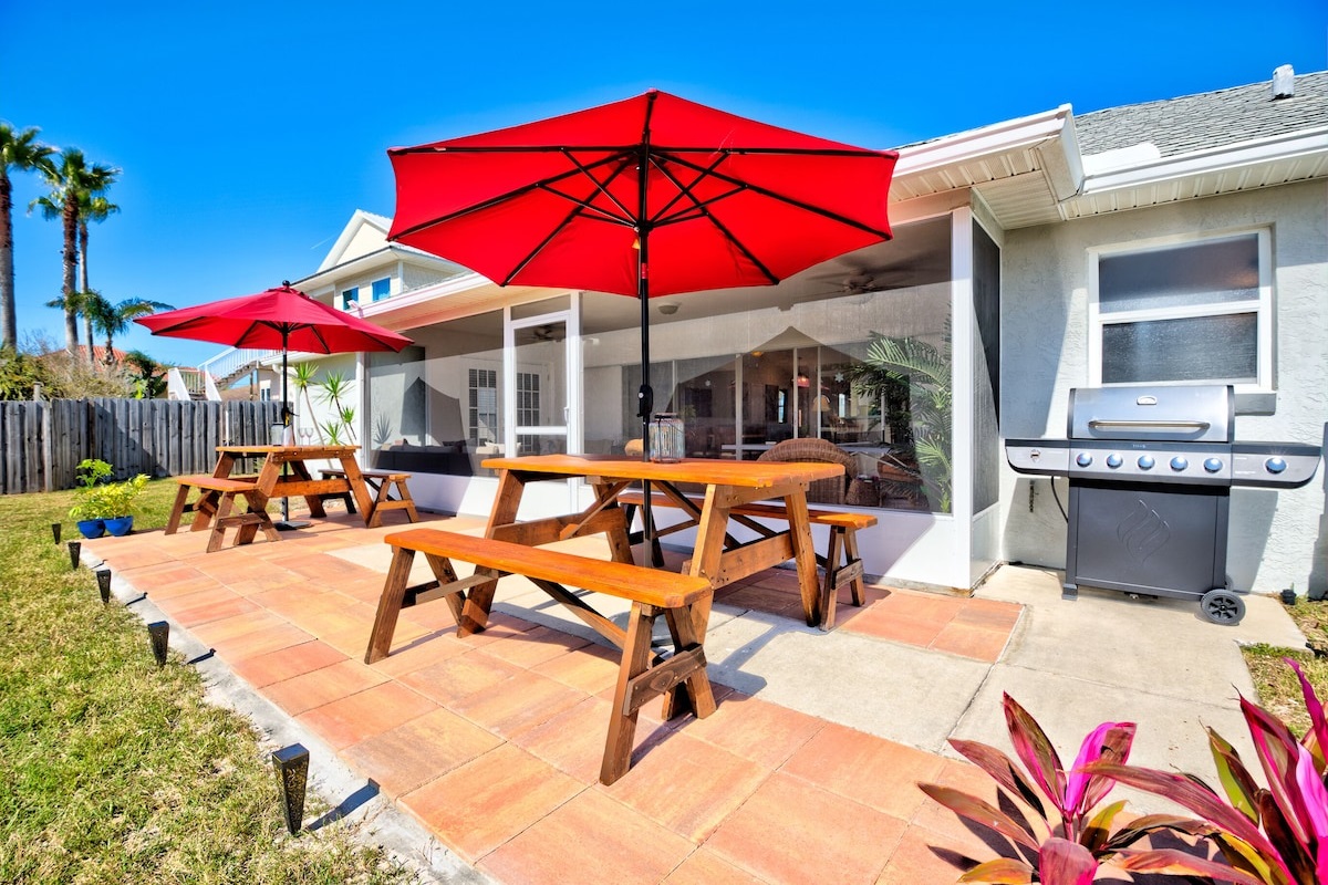 Uncovered Patio with Two Picnic Tables and Gas Grill
