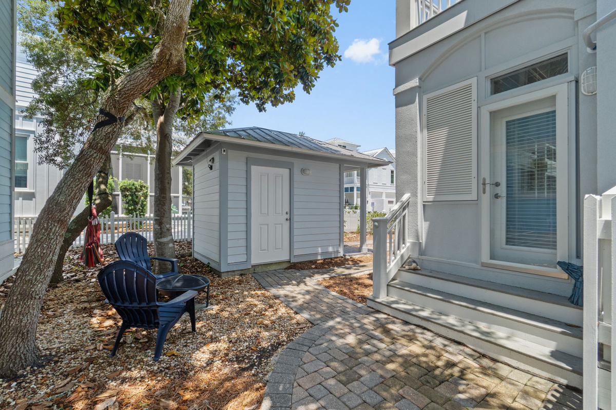 Side yard with fire pit, hammock & seating area