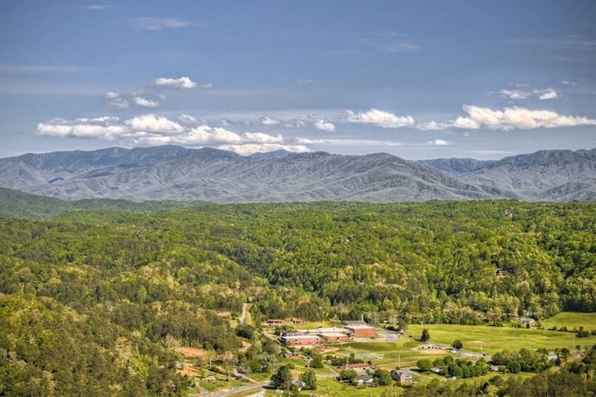 - Expansive view of rolling Smoky Mountain ridges and valley greenery   - Peaceful horizon stretching across forests and open skies all day   - Ideal for nature lovers seeking calm and panoramic mountain sights