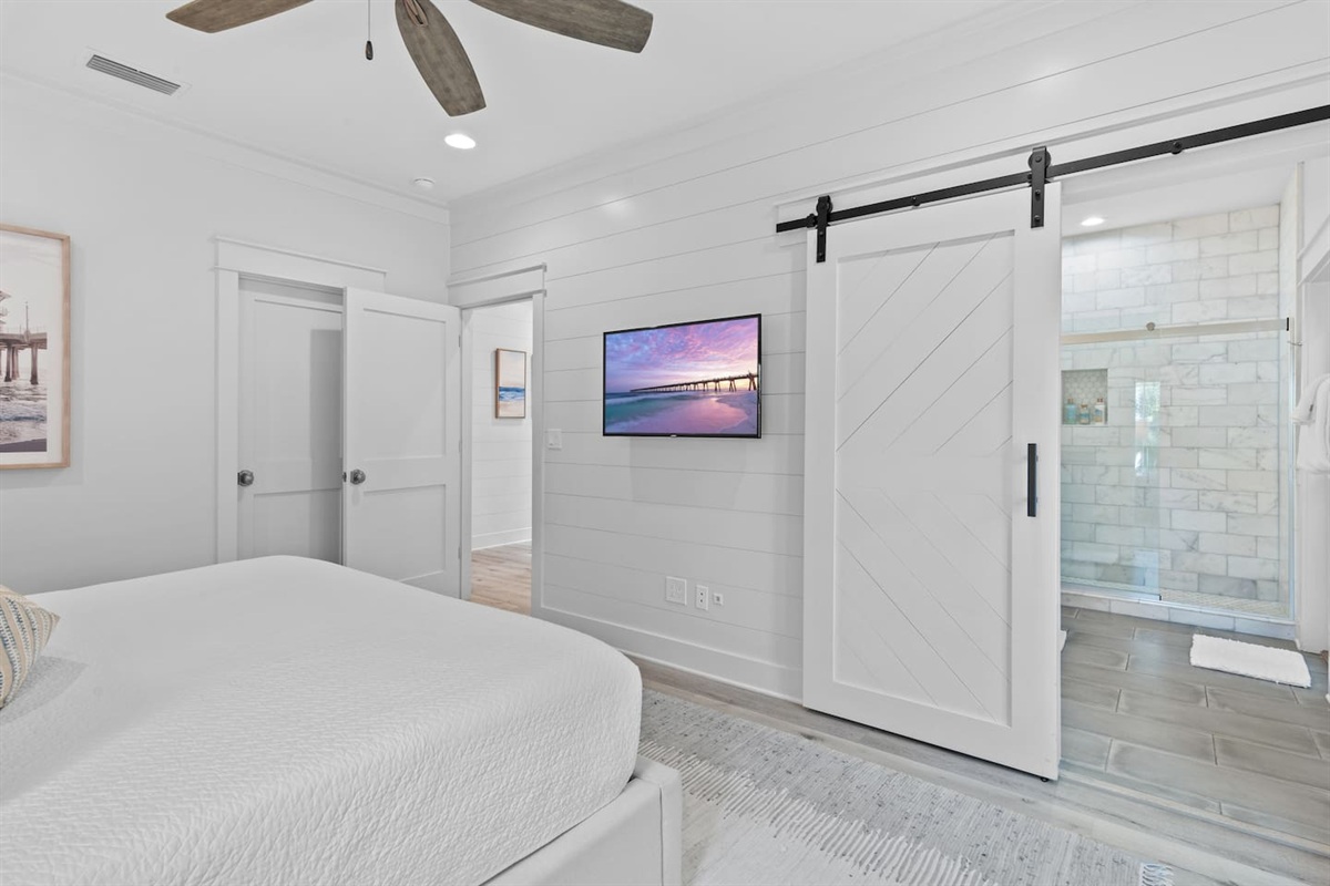 Spacious 2nd level king bedroom suite with full ensuite bathroom, tiled shower, dual vanity sinks, and newly remodeled outdoor shower.