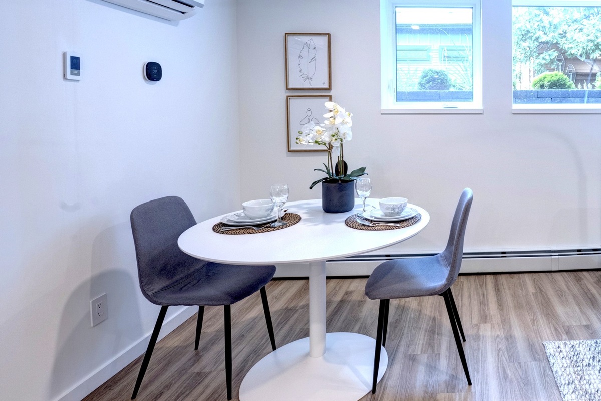 Dining area with seating for two — ideal for meals, coffee, or planning the day.