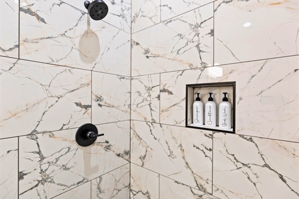 Simplicity speaks volumes in this shower, where clean lines and a pristine ambiance offer an invigorating cleanse.