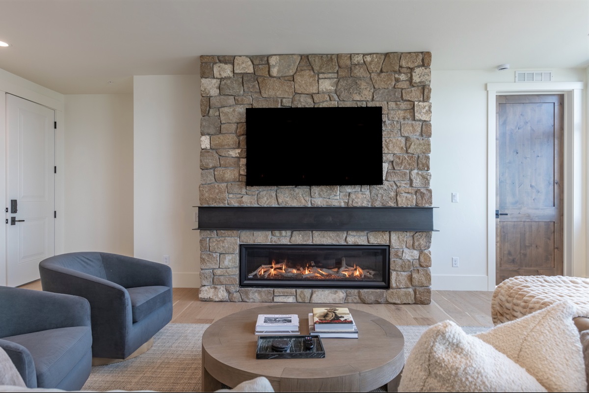 Middle Teton - Cozy up by the stone fireplace and enjoy a movie night on the large smart TV.