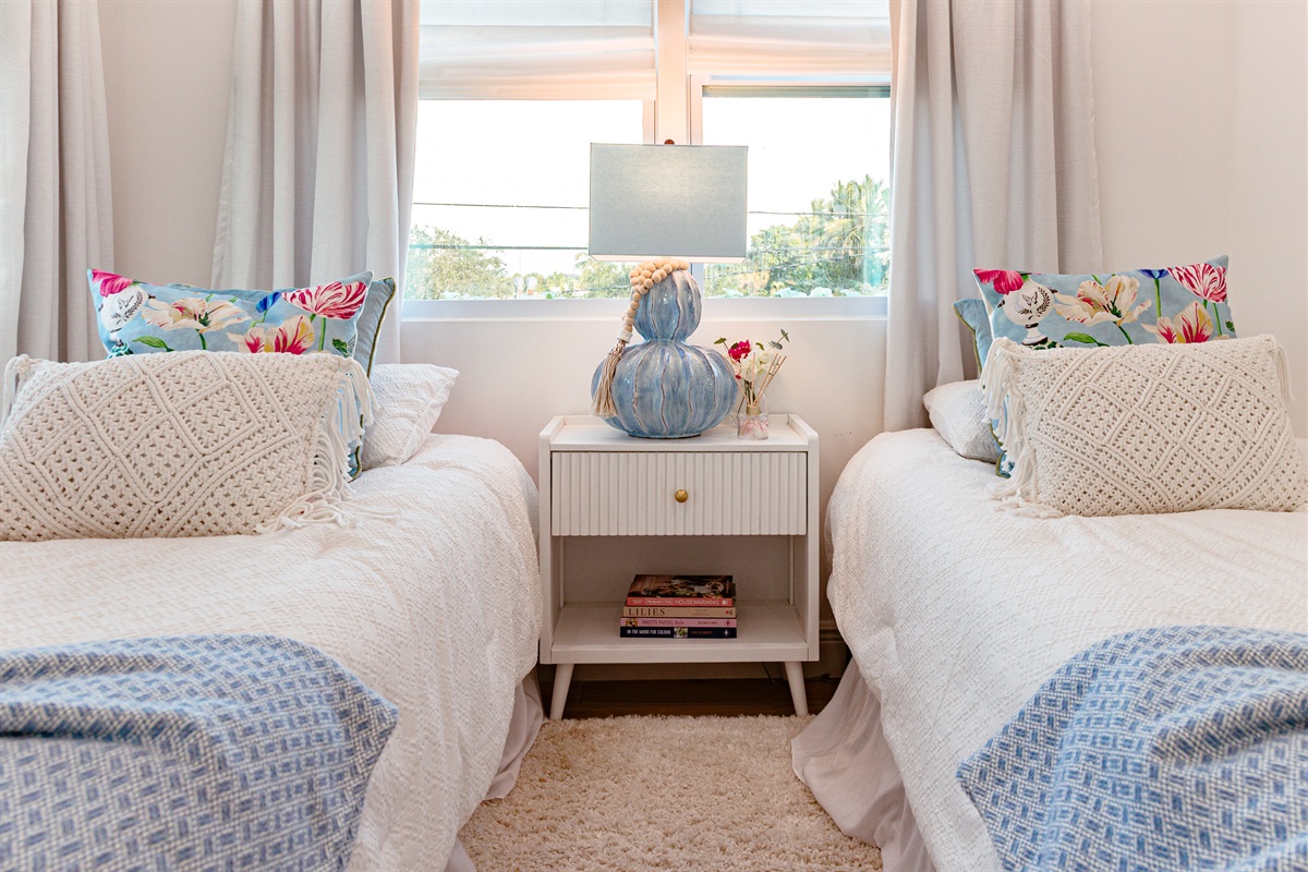 Our first cottage bedroom features two double beds, stylishly designed and very comfortable.