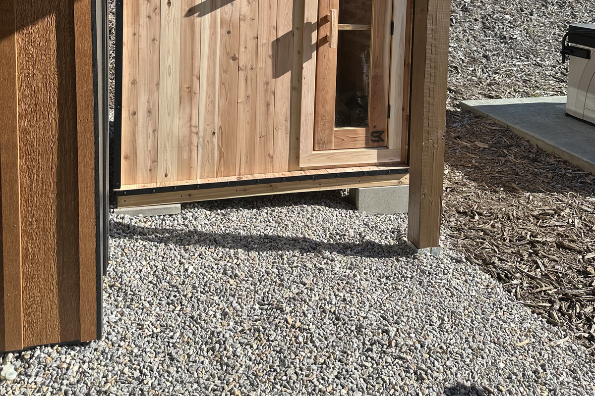 Exterior view of the private sauna, conveniently located just steps from the home.