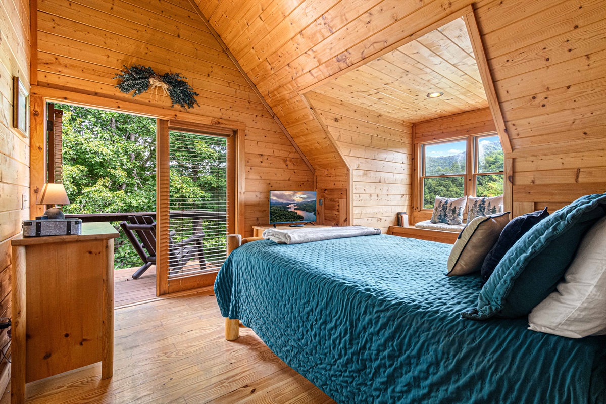 Upstairs Bedroom 2: Stunning mountain views from this bright, airy room with wooden charm!