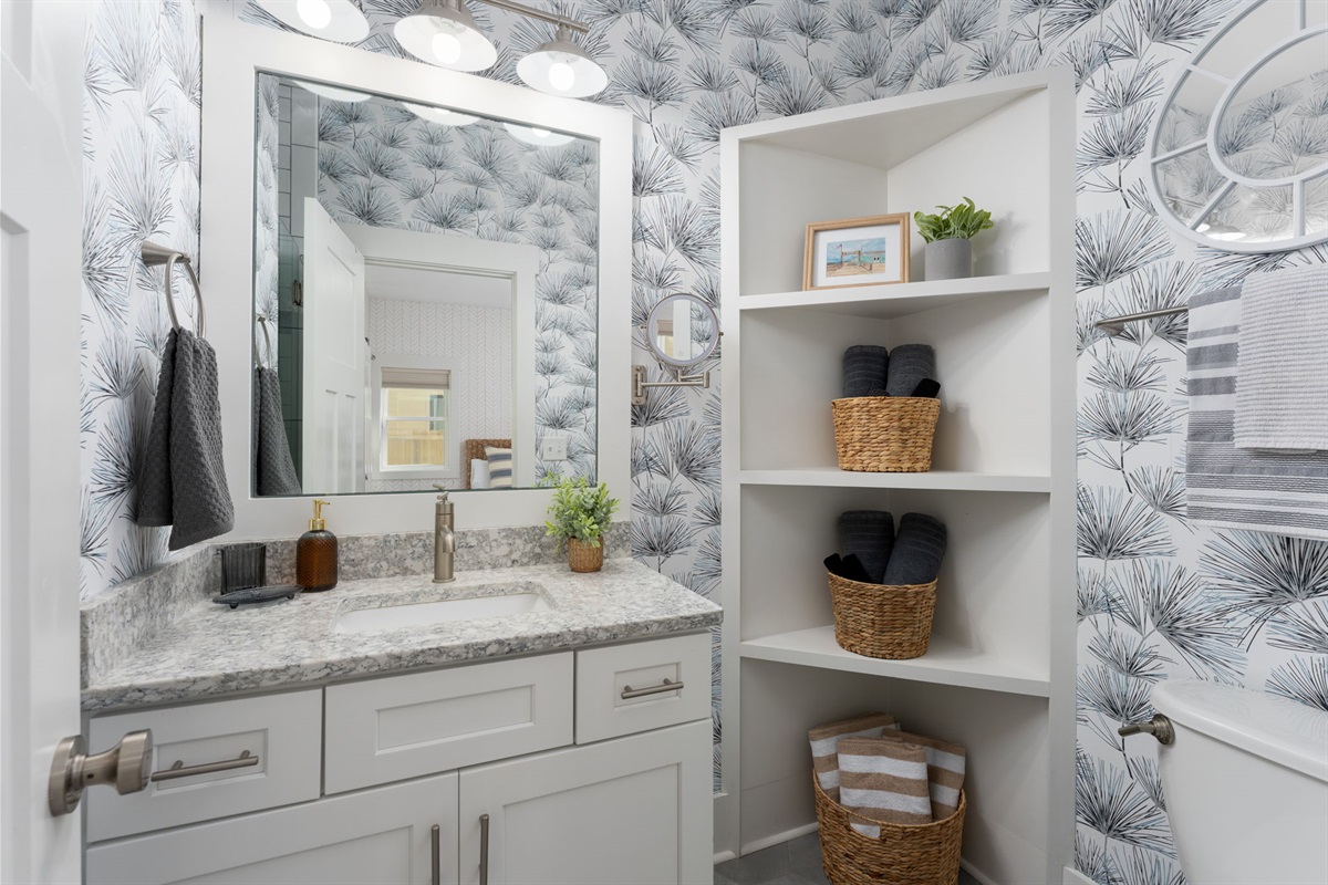 Private en suite bathroom with modern finishes, ample storage, and spa-inspired details and walk-in shower. 