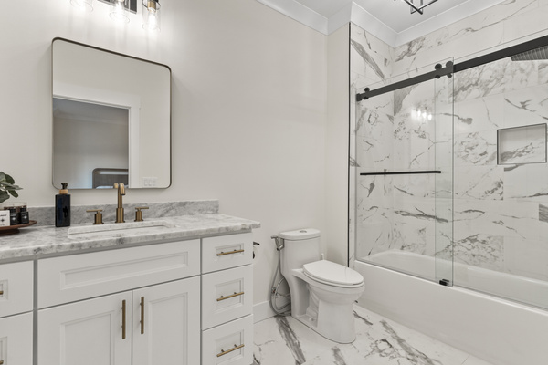 Full Bathroom attached to upstairs back bedroom. Shower/Tub combo, bidet, soaps, lotion, shampoo and conditioner. 