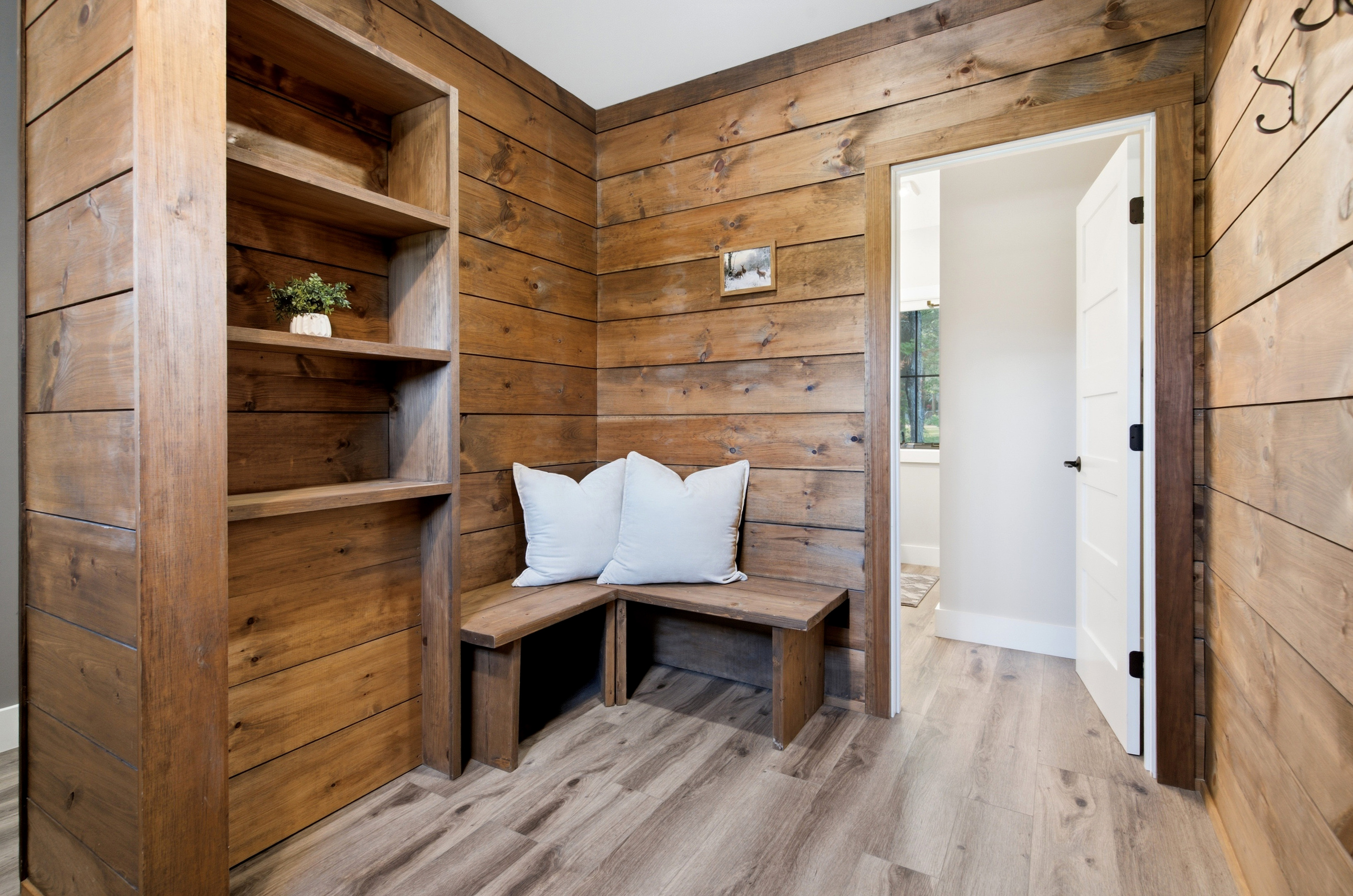 Rustic wood finishes and built-in seating bring warmth and character to the home.