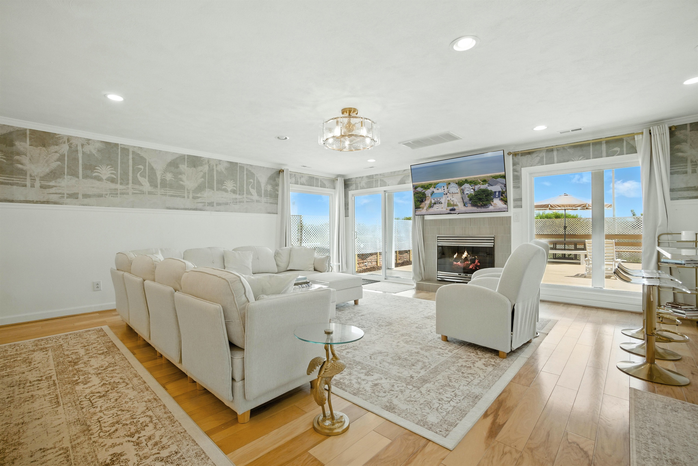 Living Room has a gas fireplace and a sliding glass door with direct access to the rear deck