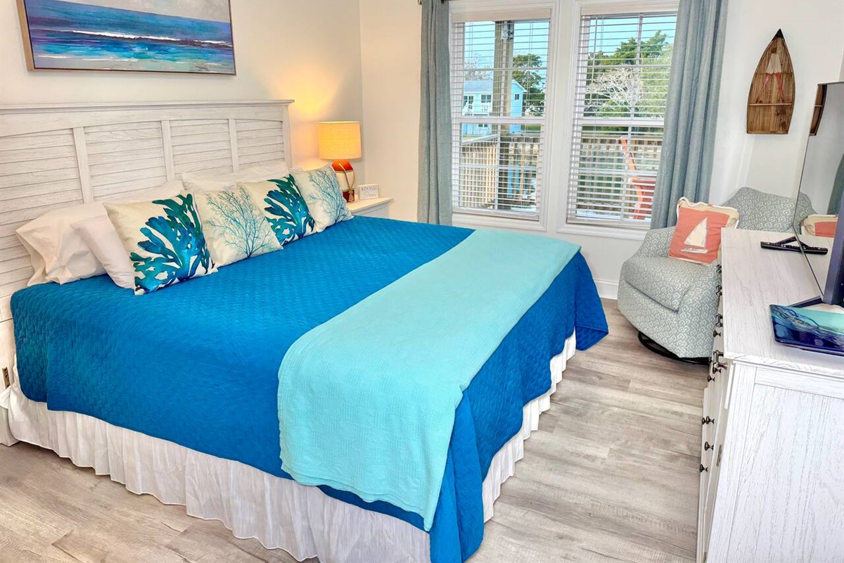 The master bedroom has a King bed, smart TV, blackout curtains, and water view.