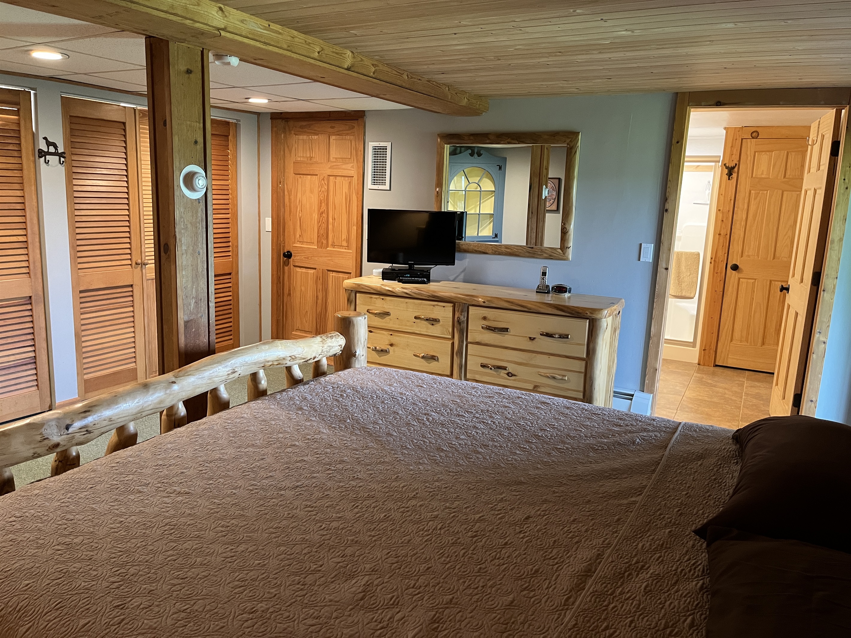 Lower level King bedroom #2 with ensuite full bathroom and smart TV.
