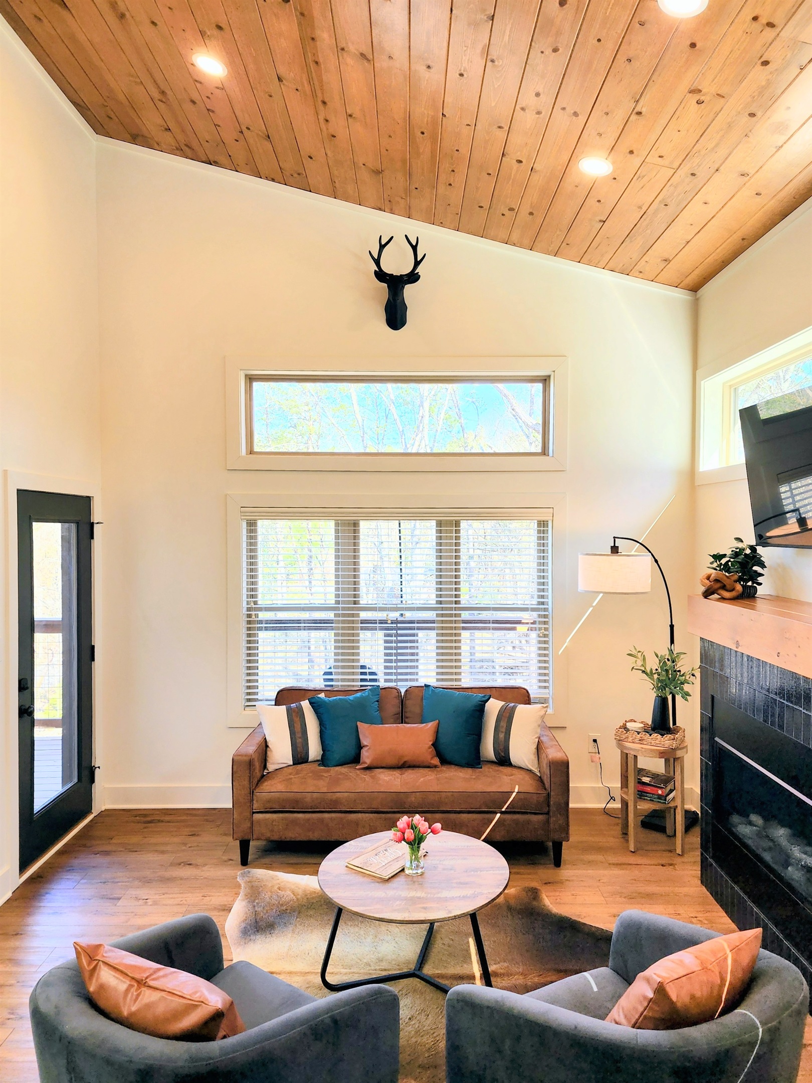 Open layout with spiral staircase and vaulted ceilings - cabin-in-the-trees vibe without feeling rustic or dated, built 2025 with all modern amenities.