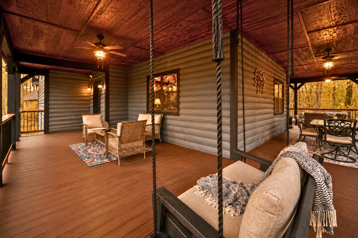 Whether you&rsquo;re reading, visiting with family, or simply slowing down for a while, the spacious porch offers plenty of room to unwind.