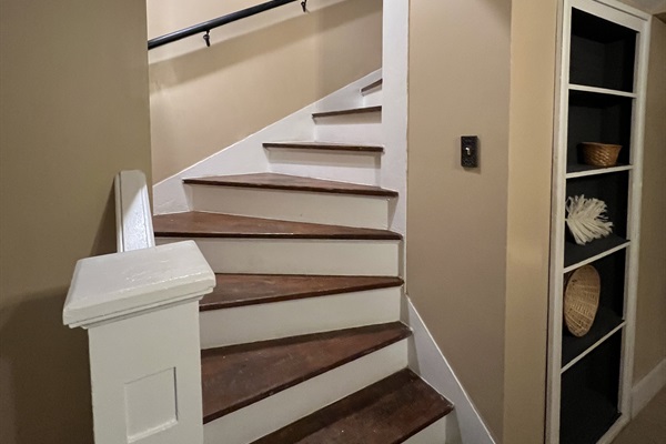 These old stairs are beautiful!  Two bedrooms upstairs (street level) and two downstairs (basement level).