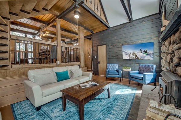 Relax in your open-concept living space—vaulted ceilings, cozy fireplace, and stylish seating invite you to unwind and make every moment yours.