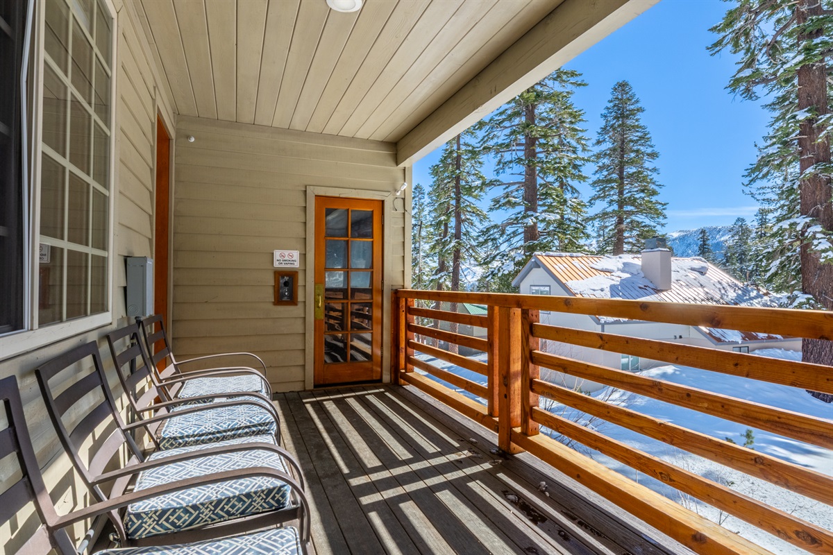 The balcony offers seating, hot tub, sauna, and overlooks a shared back garden space behind Sonenalp—great for kids, casual play, and enjoying fresh mountain air.