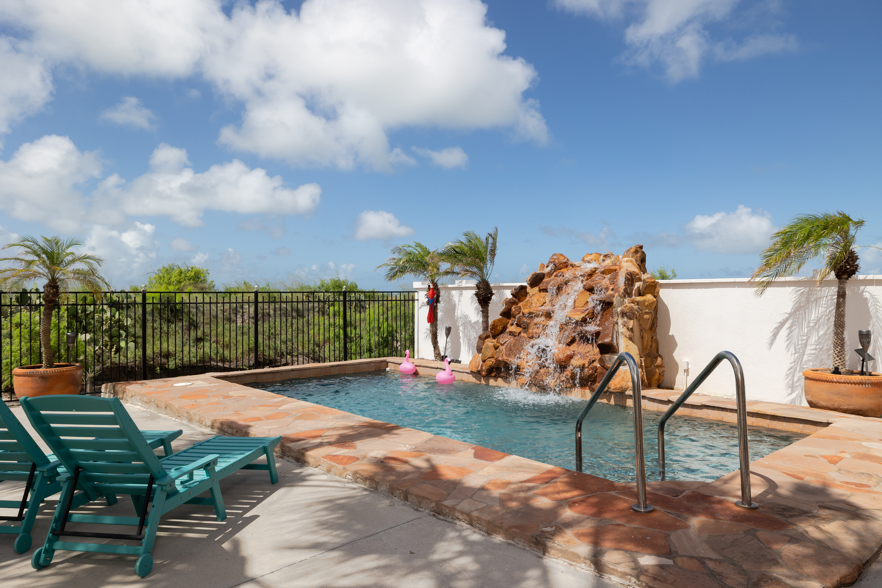 Pool deck / Waterfall / Lounge chairs