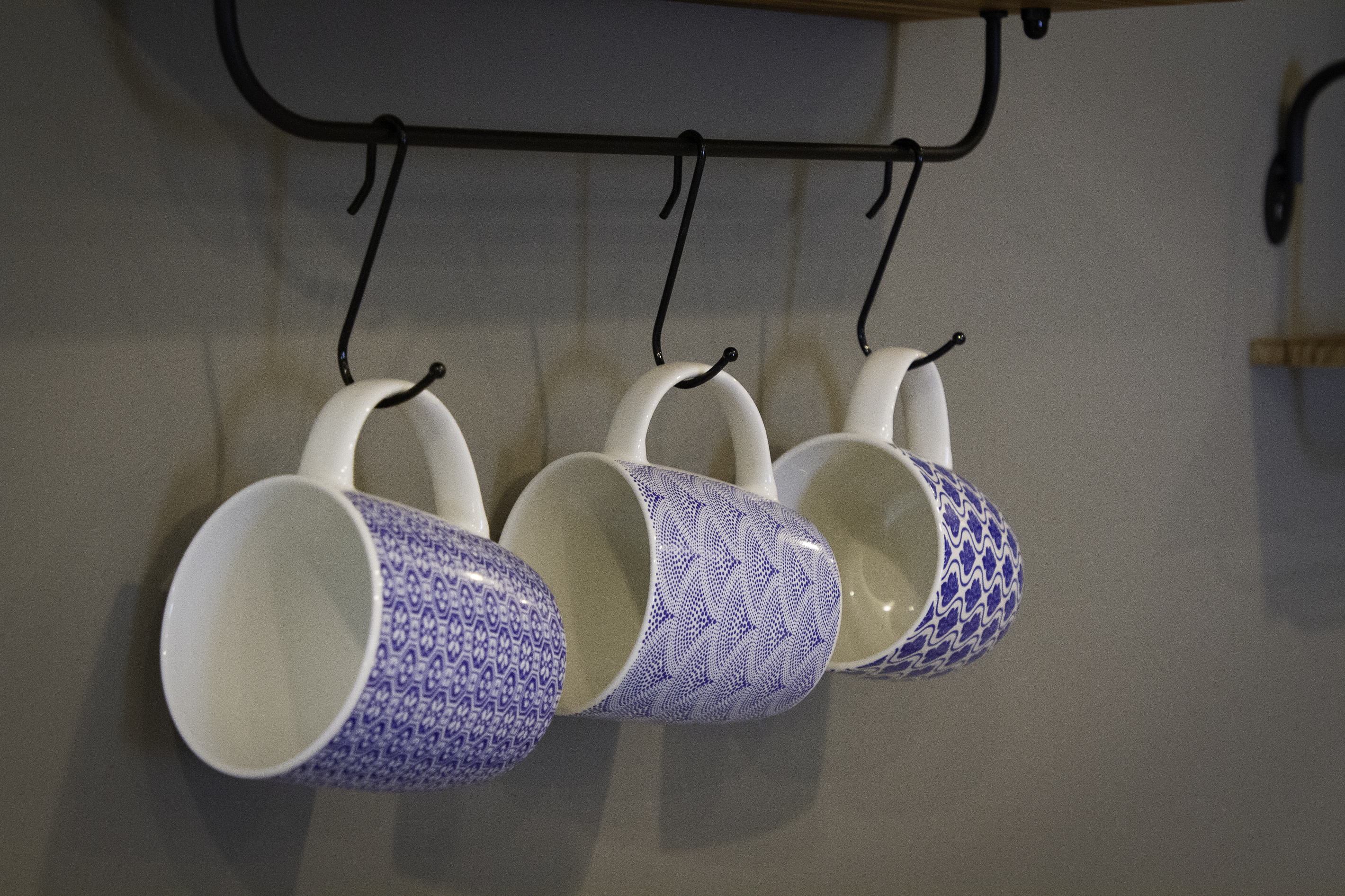 Coffee cups above the coffee bar