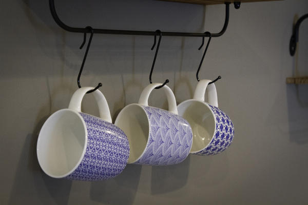 Coffee cups above the coffee bar