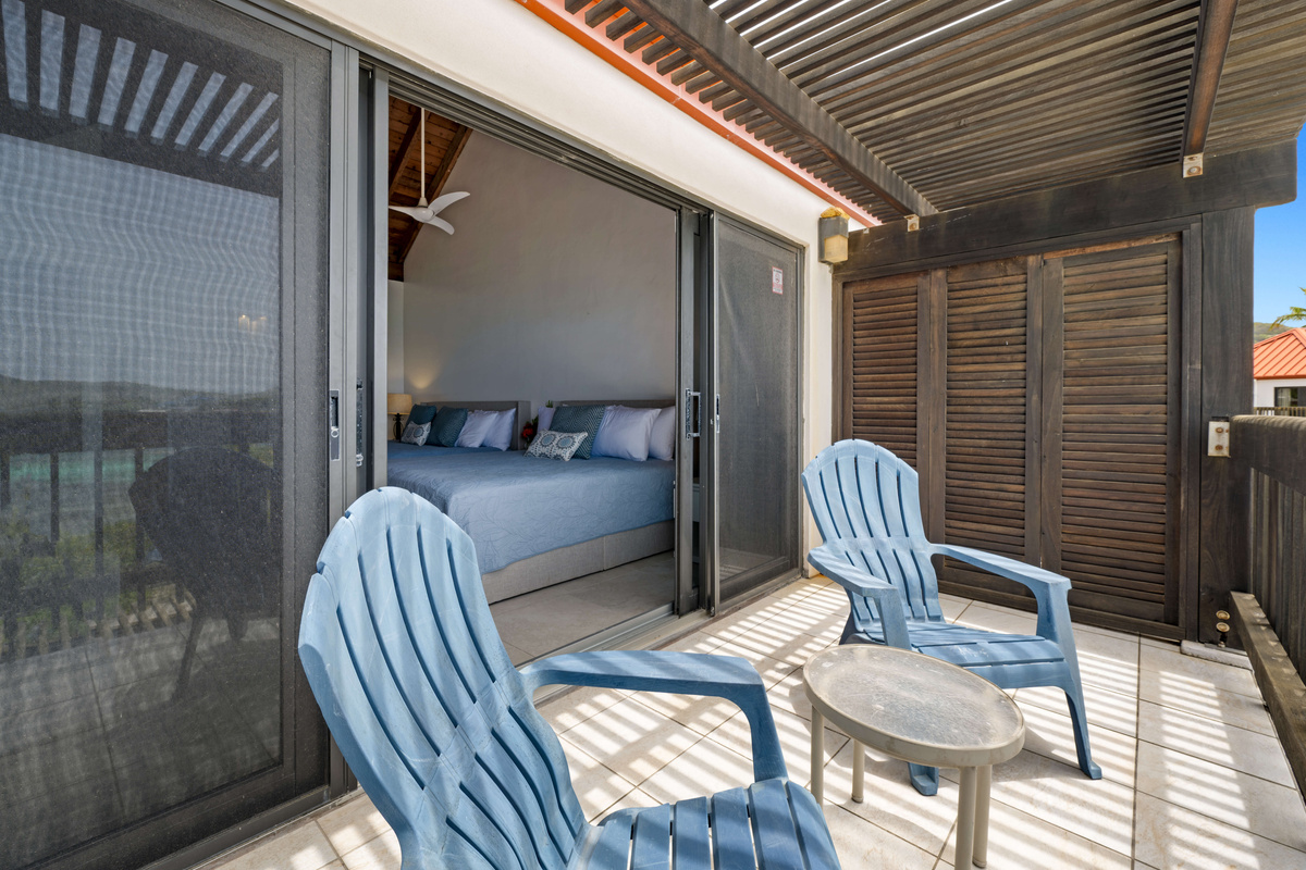 Private outdoor living space offering comfort, fresh island breezes, and stunning scenery.