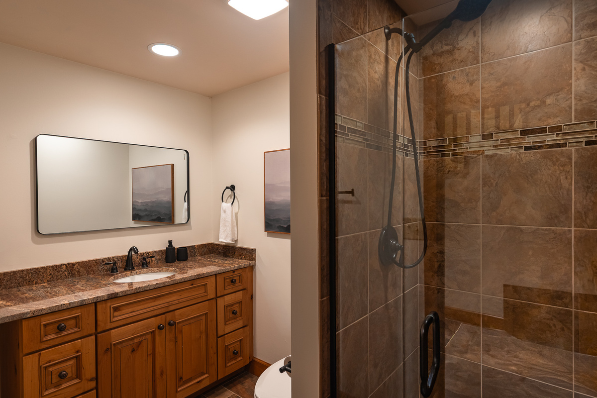 {Bathroom 5} A spacious double vanity and oversized walk-in shower give this full bathroom plenty of room for guests to get ready comfortably.