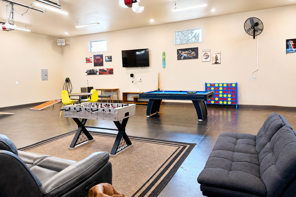 The Shop is the perfect hangout spot which features a pool table, ping pong table, foosball table, basketball arcade, a 65 inch TV, and a beverage fridge.