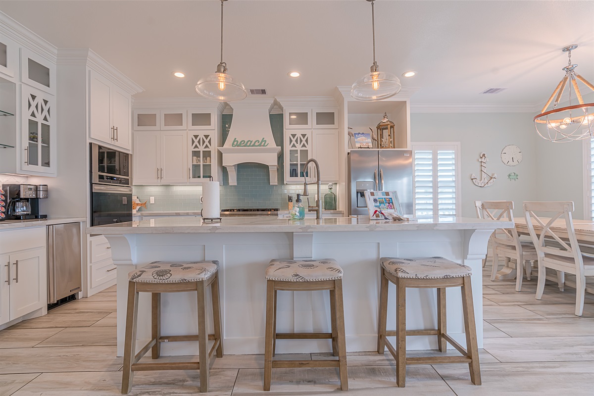 Gourmet kitchen with coffee bar in the open layout.