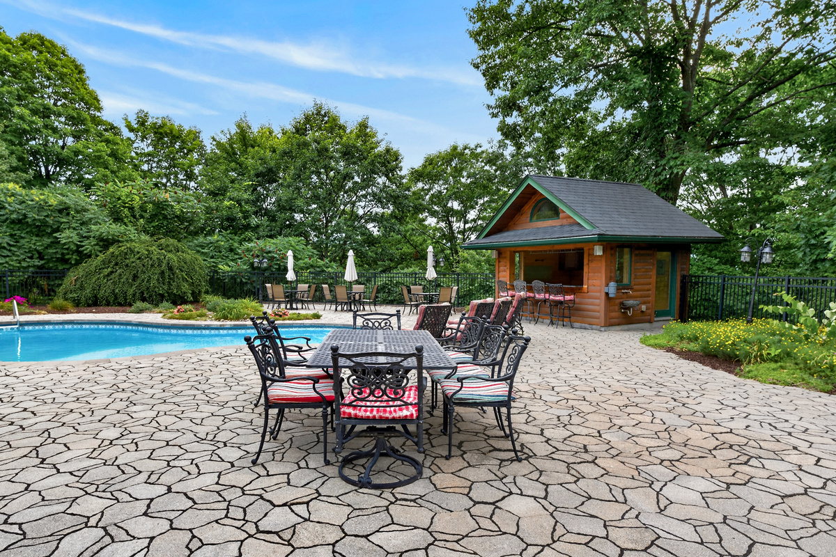 Poolside dining table on stone patio