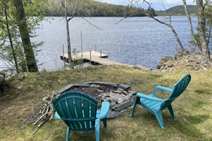 Firepit, 2 chairs with lakeview and dock on the water
