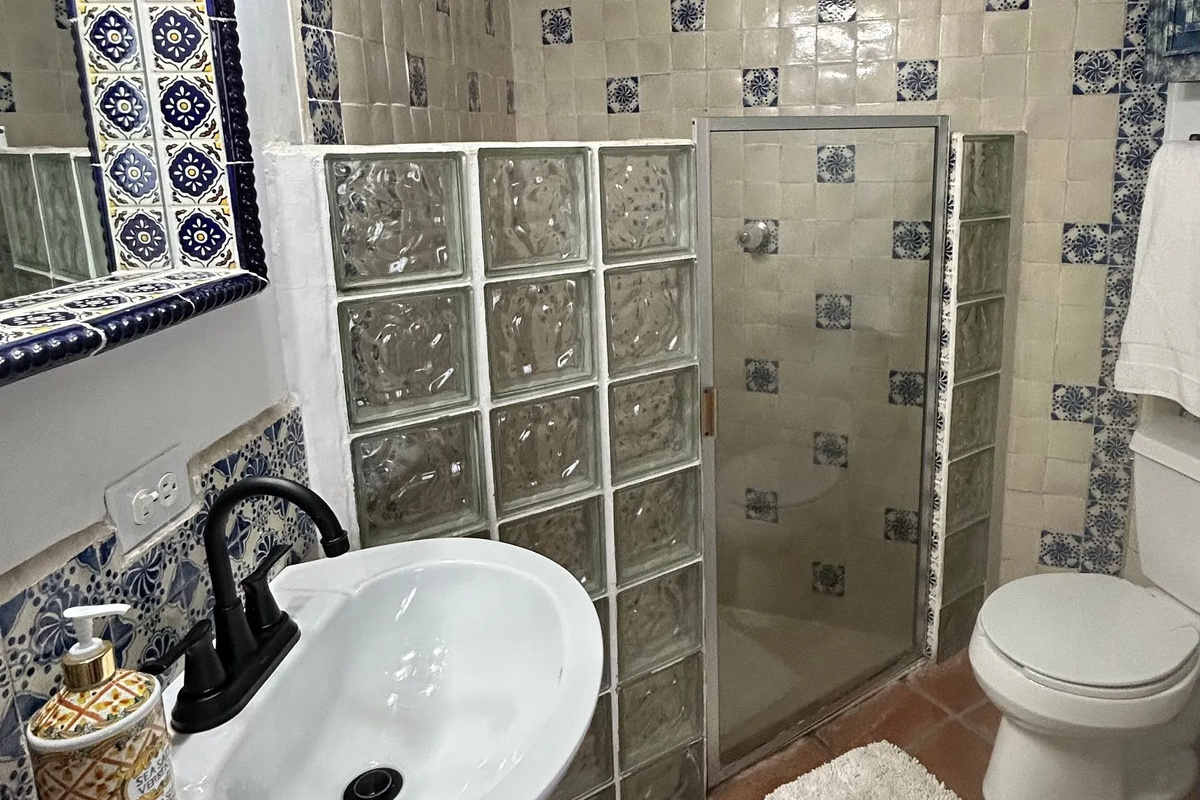 Patio suite with adjacent bathroom