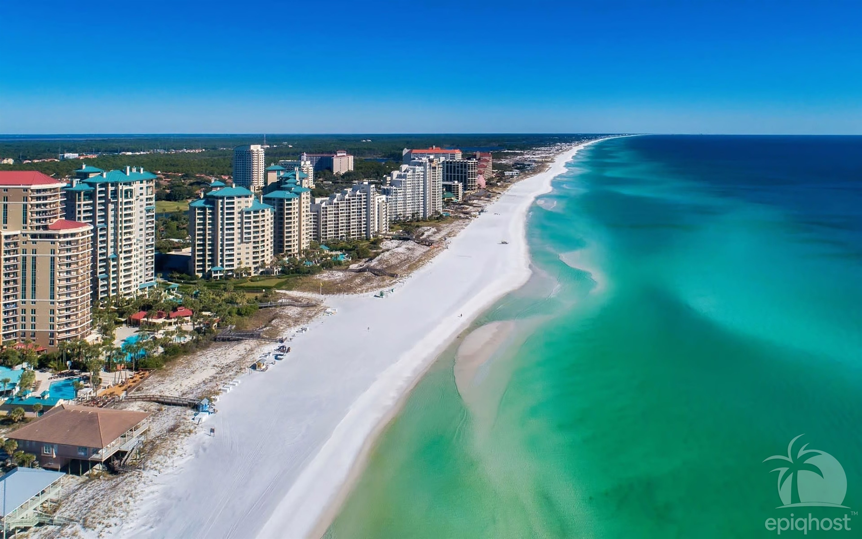 Sandestin beach with white sand and emerald water
