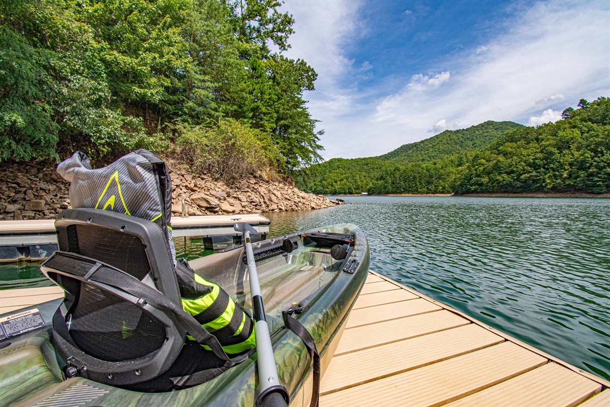 Lakefront Adventure: Launch your kayak from the dock and explore stunning mountain views!