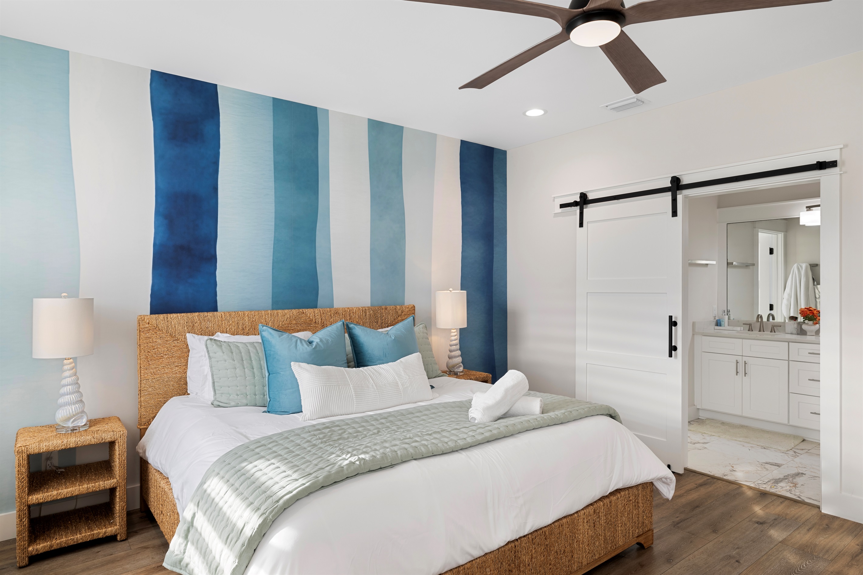 Upstairs Master Suite with private ensuite bathroom and serene coastal design