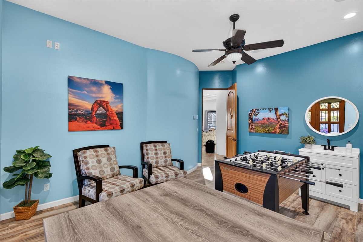 Private game lounge with foosball and conversation seating creates the perfect space for friendly competition