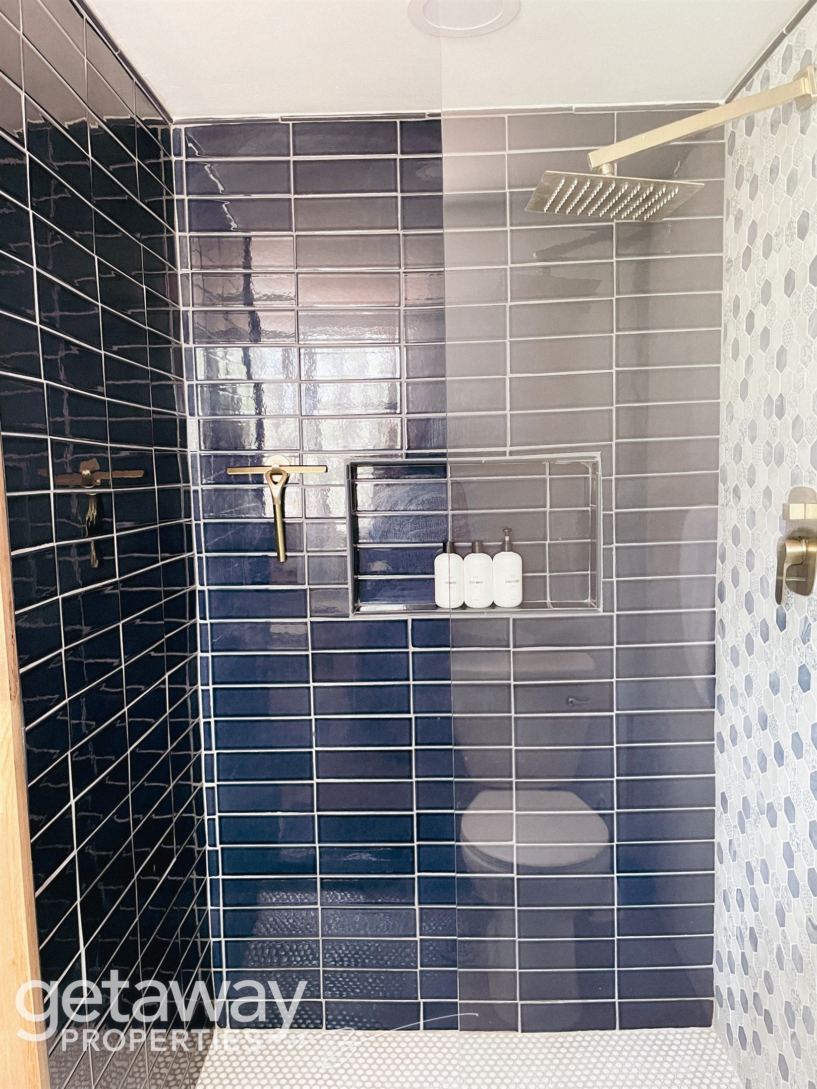 Bright, clean full bathroom stocked with essentials for your stay