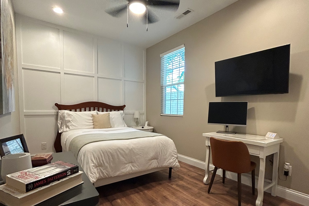 Secondary with queen bed and work station