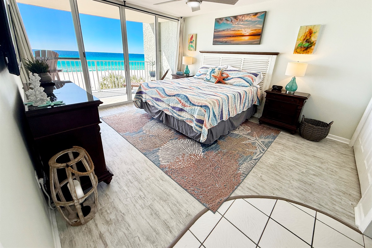 Super comfortable Cal King mattress with beautiful emerald green Gulf front views.