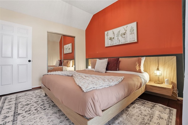 Bedroom with King Bed, 43" TV, closet and Balcony access